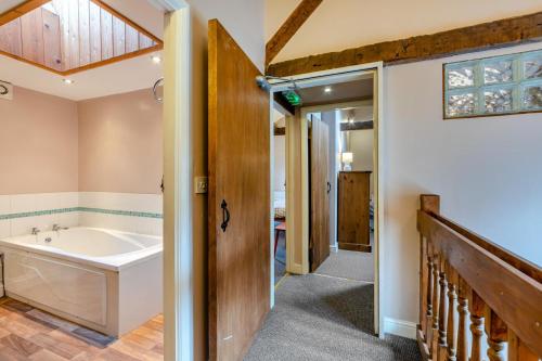 a bathroom with a bath tub and a sink at 2 Bed in Eggleston oc-l30452 in Middleton in Teesdale