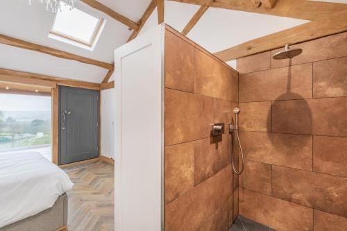 a bathroom with a shower and a bed in a room at 2 Bed in Allendale oc-r29078 in Allendale Town