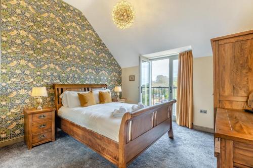 a bedroom with a large bed and a large window at 1 Bed in Pershore oc-t29049 in Pershore
