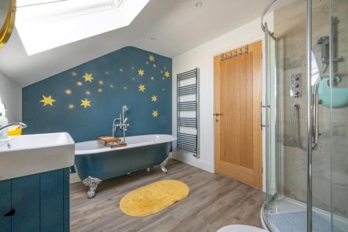 a bathroom with a blue wall with stars on it at 3 Bed in Chatton oc-nb1987 in Chatton