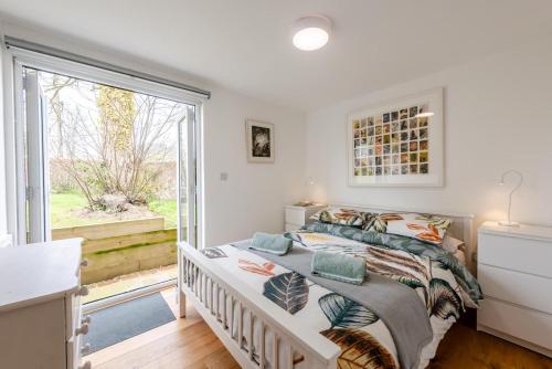 a white bedroom with a bed and a window at 2 Bed in Battle oc-m31780 in Battle