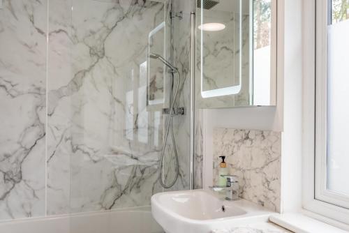 a white bathroom with a shower and a sink at 2 Bed in Battle oc-m31780 in Battle