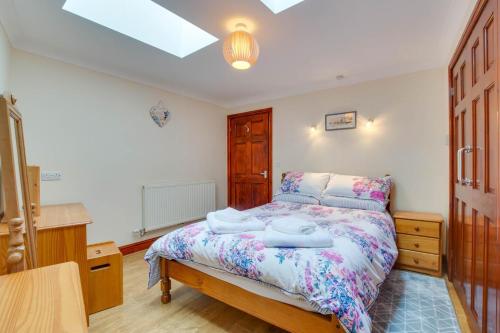 a bedroom with a bed with two towels on it at 1 Bed in Robeston Wathen oc-pw9200 in Robeston Wathen