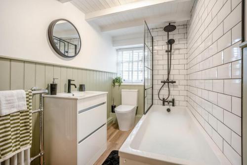 a bathroom with a tub and a sink and a toilet at 3 Bed in Pickering oc-t33630 in Pickering