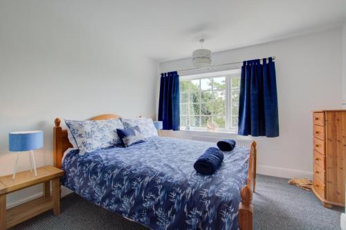 a bedroom with a bed and a window at 4 Bed in Wiggenhall St. Germans oc-2011 in King's Lynn