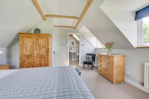 a bedroom with a bed and a wooden dresser at 1 Bed in Wadhurst oc-tw668 in Ticehurst