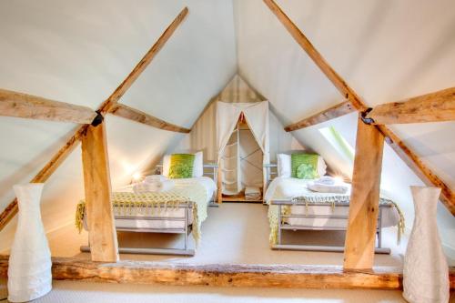 a room with two beds in a attic at 2 Bed in Briston oc-1551 in Briston