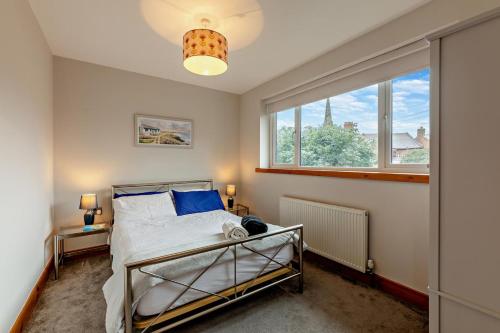 a bedroom with a bed and a window at 3 Bed in North Shields oc-b29939 in Tynemouth