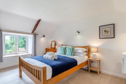 a bedroom with a bed with a teddy bear on it at 5 Bed in Bodmin oc-l29658 in Blisland