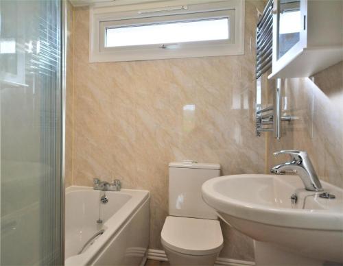 a bathroom with a toilet and a sink and a bath tub at 2 Bed in St. Merryn oc-p00673 in Saint Merryn