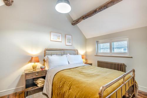 a bedroom with a large bed and a window at 3 Bed in Westmancote oc-t30722 in Kemerton