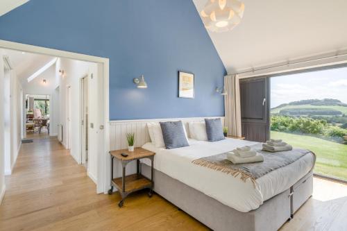 a bedroom with a large bed and a large window at 2 Bed in Newburgh oc-g32594 in Newburgh