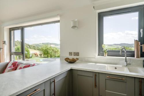 a kitchen with a sink and a large window at 2 Bed in Newburgh oc-g32594 in Newburgh