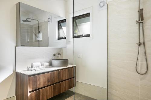 a bathroom with a sink and a shower at Azabu Retreat in Byron Bay
