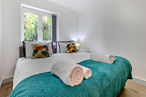 a bedroom with two beds with towels on them at 4 Bed in Retorrick Mill oc-t28899 in Saint Mawgan