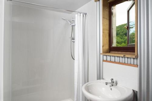 a bathroom with a sink and a mirror at 1 Bed in Talybont-on-Usk oc-a29348 in Talybont