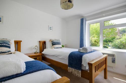 two beds in a room with a window at 2 Bed in Kelling oc-1716 in Kelling