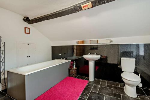 a bathroom with a tub and a toilet and a sink at 3 Bed in Bowness-on-Solway oc-p28797 in Bowness-on-Solway