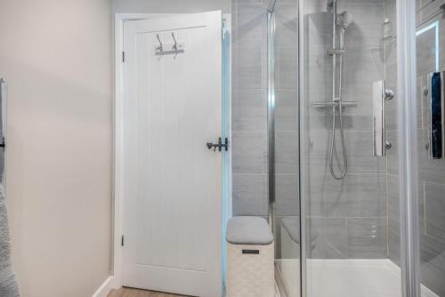 a bathroom with a shower with a glass door at 2 Bed in Braithwaite oc-p31730 in Braithwaite