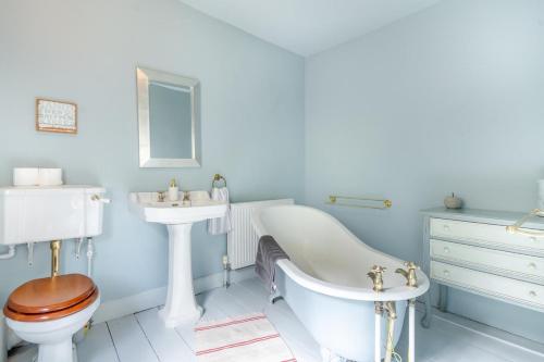 a bathroom with a sink and a tub and a toilet at 4 Bed in Matlock Bath oc-r32432 in Matlock Bank