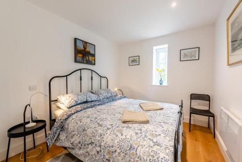 a bedroom with a bed and two tables and a window at 2 Bed in Battle oc-c31781 in Battle