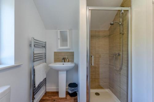 a bathroom with a sink and a shower at 3 Bed in Coldingham oc-b29846 in Coldingham