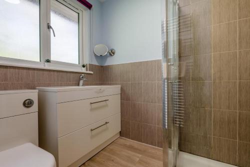 a bathroom with a shower and a sink at 2 Bed in Bush oc-h31848 in Bude