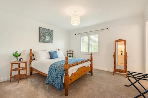 a bedroom with a bed and a mirror in it at 3 Bed in Longtown oc-h30069 in Longtown