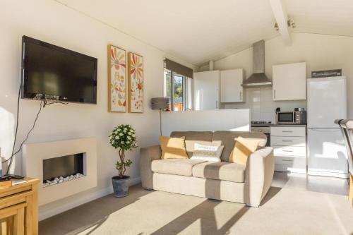 a living room with a couch and a flat screen tv at 2 Bed in Felton oc-w30642 in Felton