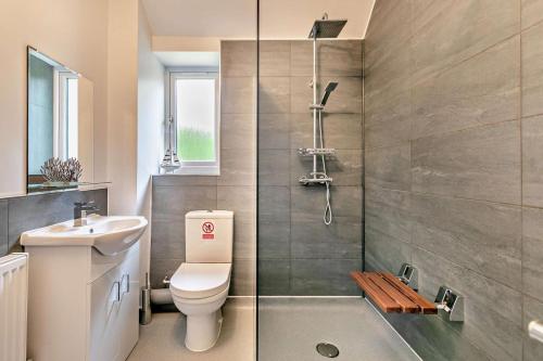 a bathroom with a toilet and a sink and a shower at 4 Bed in Retorrick Mill oc-w28897 in Saint Mawgan