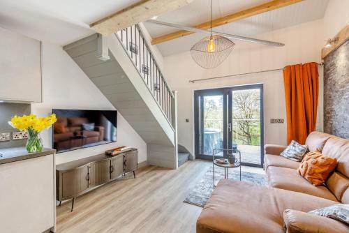 a living room with a couch and a tv at 1 Bed in Berriew oc-a31113 in Berriew