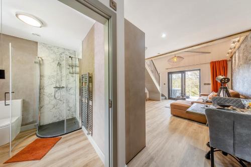 a bathroom with a shower and a bed in a room at 1 Bed in Berriew oc-a31113 in Berriew
