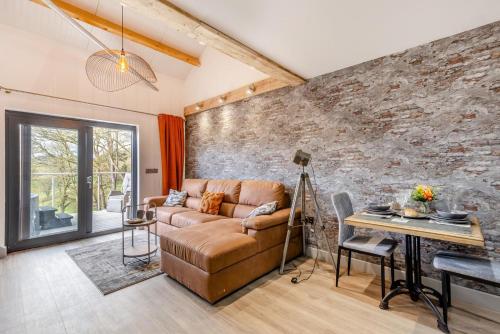 a living room with a couch and a table at 1 Bed in Berriew oc-a31113 in Berriew