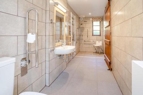 a bathroom with a sink and a toilet at 7 Bed in Talgarth oc-h30349 in Talgarth