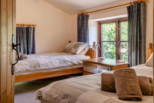a bedroom with two beds and a window at 7 Bed in Talgarth oc-h30349 in Talgarth