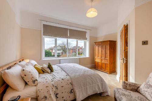 a bedroom with a bed and a window at 3 Bed in Lytham St. Annes oc-m30622 in Saint Annes on the Sea