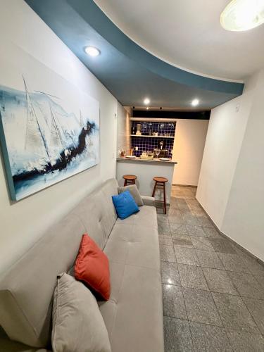 a living room with a couch and a table at Flat em natal beira mar in Natal