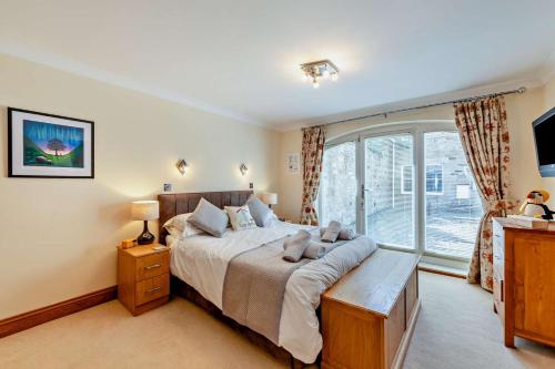 a bedroom with a large bed and a window at 1 Bed in Beadnell oc-l29758 in Beadnell