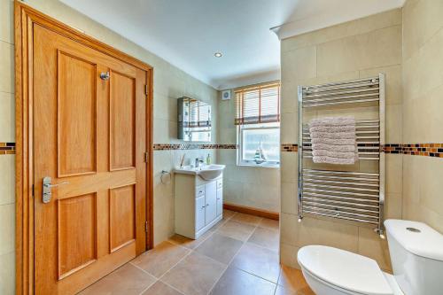 a bathroom with a toilet and a sink at 1 Bed in Beadnell oc-l29758 in Beadnell