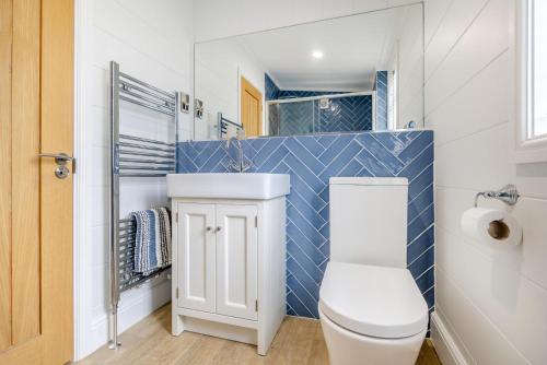 a bathroom with a toilet and a sink at 2 Bed in Tallington oc-b32208 in Barholm