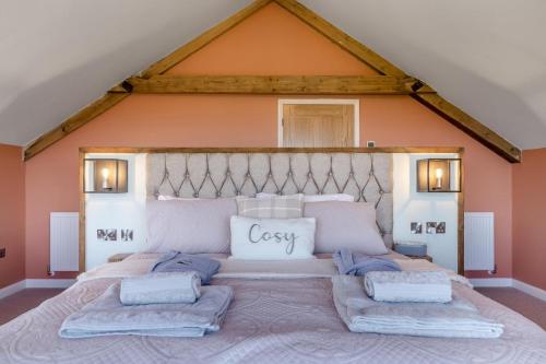a large bedroom with a large bed in a attic at 1 Bed in Llanover oc-y30114 in Llanover