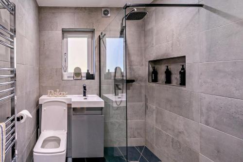 a bathroom with a toilet and a sink and a shower at 1 Bed in St. Andrews oc-c30132 in St. Andrews