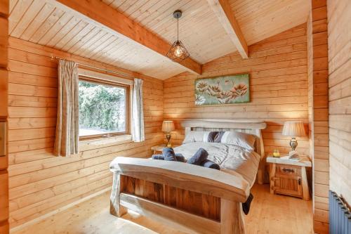 a bedroom with a bed in a wooden room at 3 Bed in Llanddulas oc-r27872 in Llanddulas