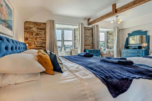 a bedroom with a large bed with pillows on it at 7 Bed in St. Agnes oc-p28968 in St. Agnes