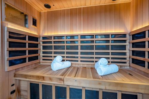 a sauna with blue cushions in a wooden room at 2 Bed in Lancing oc-t29902 in Lancing
