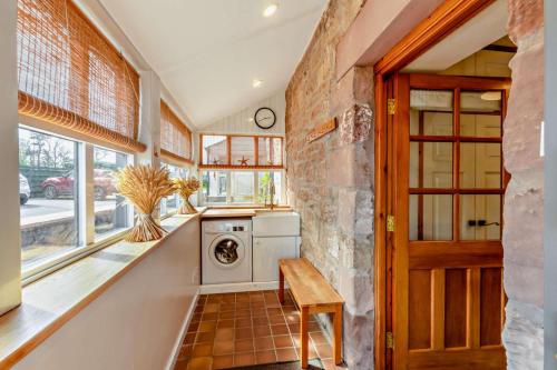 a kitchen with a washer and dryer in a room at 2 Bed in Belford oc-c29288 in Fenham