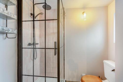 a shower with a glass door in a bathroom at 2 Bed in Lochinver oc-t30029 in Clachtoll