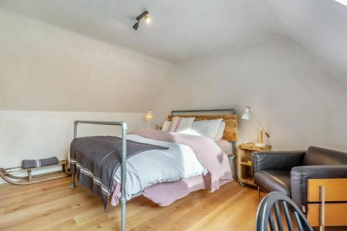 a bedroom with a bed and a couch at 2 Bed in Lochinver oc-t30029 in Clachtoll
