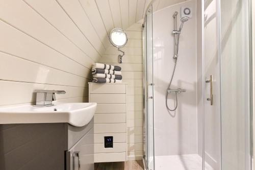 a bathroom with a sink and a shower at 1 Bed in Abersoch oc-thepod in Abersoch