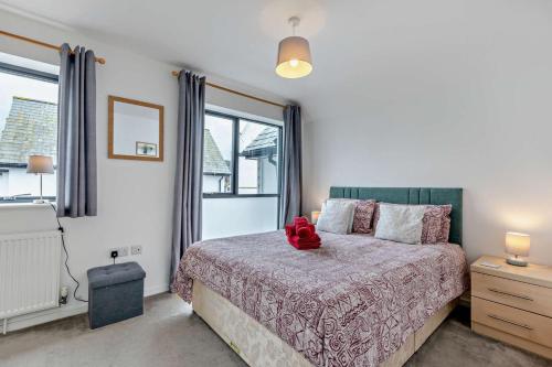 a bedroom with a bed and a large window at 3 Bed in Ilfracombe oc-s29585 in Ilfracombe